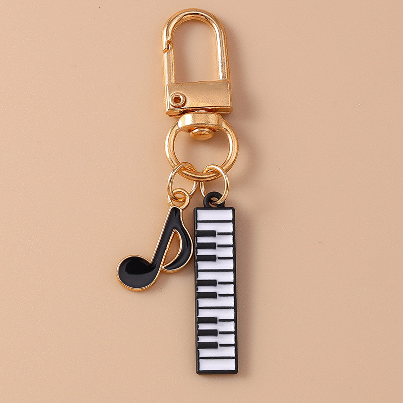 Cute Enamel Mini Piano Keychai - огляд і ціна Musical Instrument Tabla